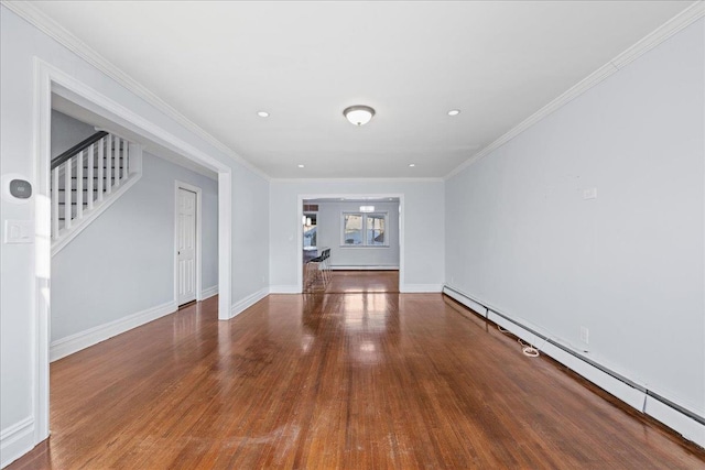 unfurnished living room featuring baseboard heating, crown molding, and wood-type flooring