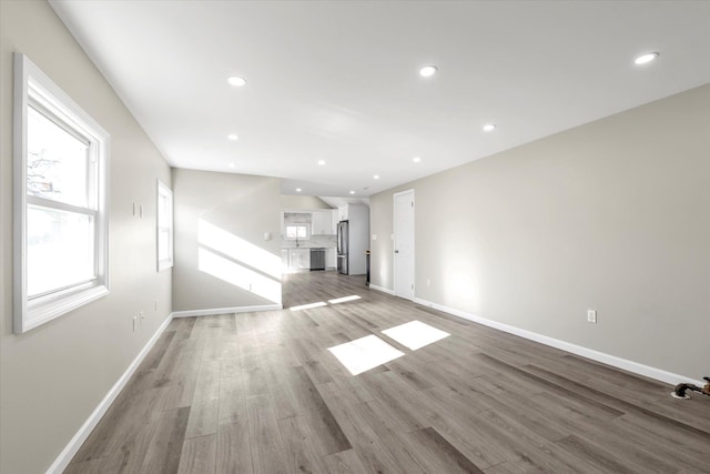 unfurnished living room featuring light hardwood / wood-style flooring