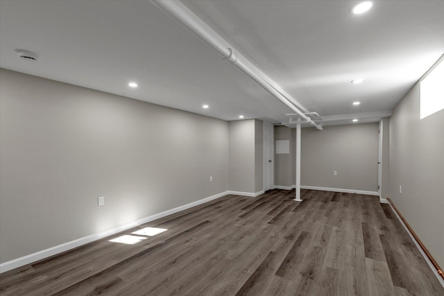 basement with hardwood / wood-style flooring