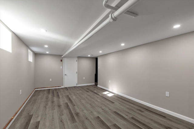 basement featuring light hardwood / wood-style floors