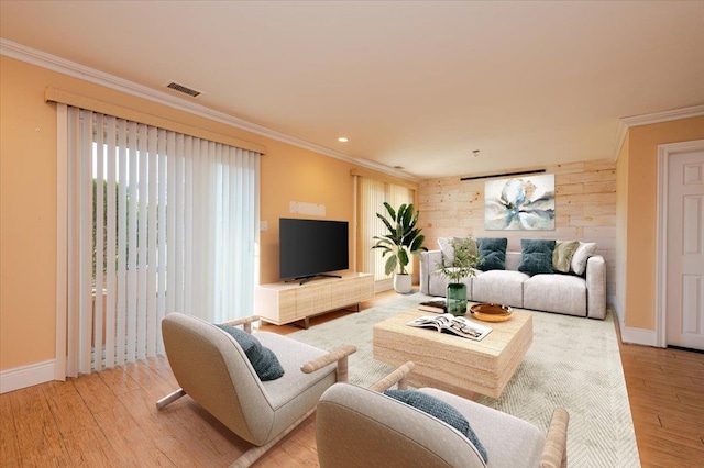 living room with wood walls, light hardwood / wood-style floors, and crown molding