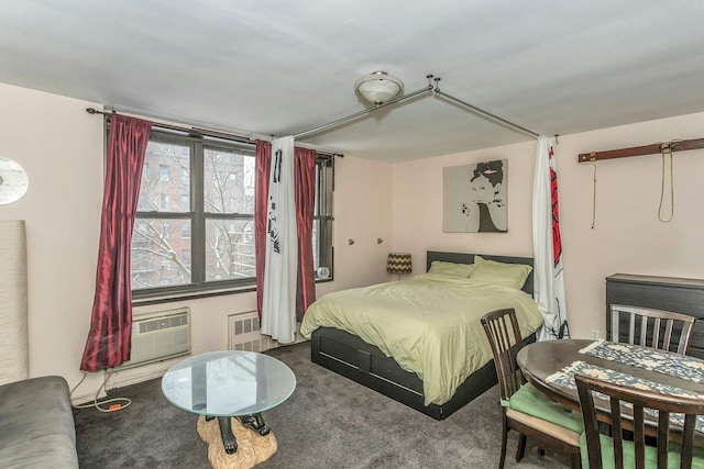 carpeted bedroom featuring a wall unit AC and radiator