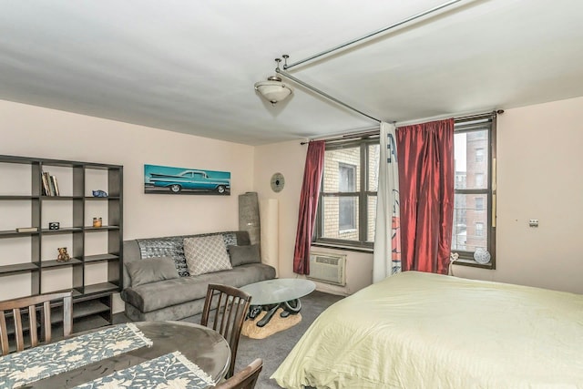 bedroom featuring an AC wall unit