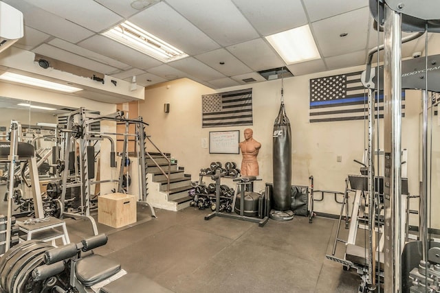 gym featuring a drop ceiling