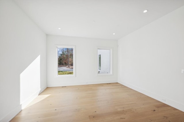 unfurnished room featuring light hardwood / wood-style flooring