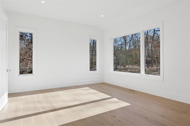 unfurnished room featuring light hardwood / wood-style floors