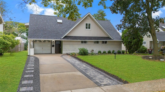 view of front facade with a front yard and a garage