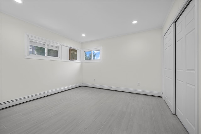 unfurnished bedroom with a closet and light wood-type flooring