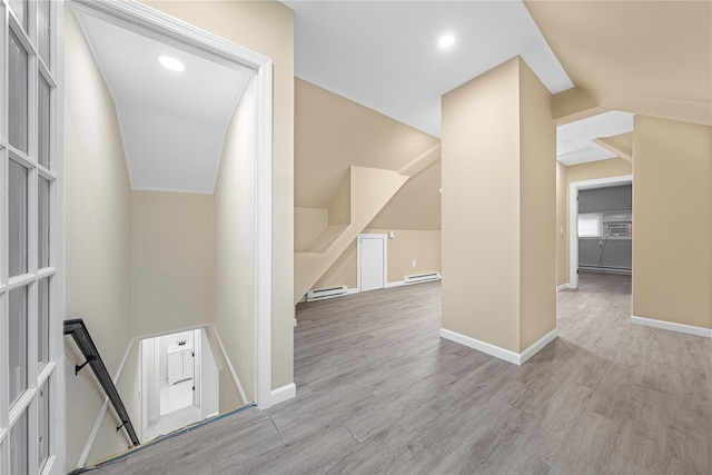 hall featuring baseboard heating and light wood-type flooring