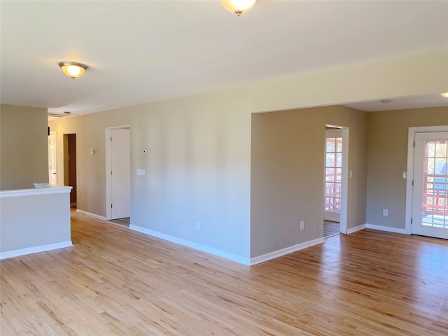 unfurnished room featuring light hardwood / wood-style flooring