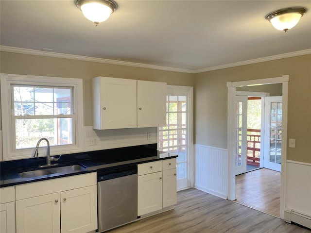 kitchen featuring white cabinets, sink, light hardwood / wood-style flooring, stainless steel dishwasher, and a baseboard radiator