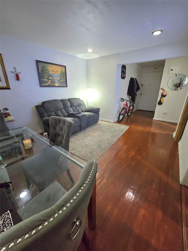 living room featuring dark hardwood / wood-style flooring