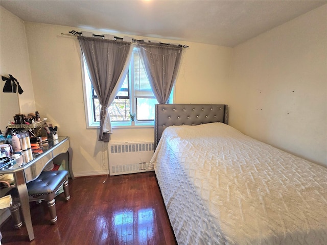 bedroom featuring radiator and dark wood-type flooring