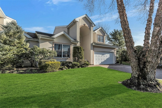 view of front of property with a garage and a front yard