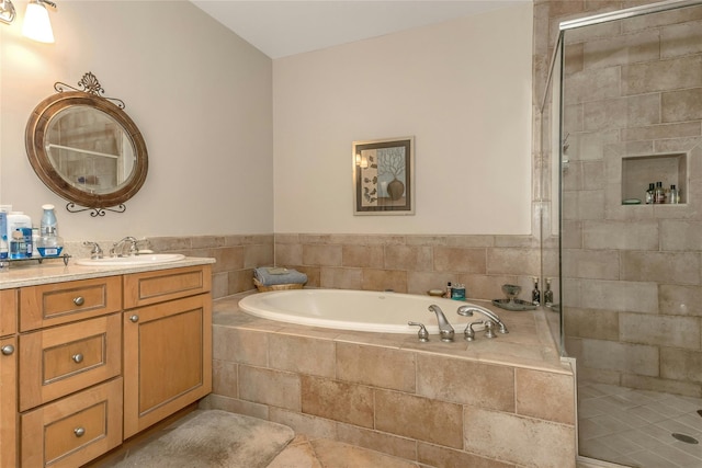 bathroom with separate shower and tub, tile patterned floors, and vanity