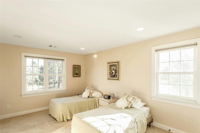 bedroom featuring light carpet