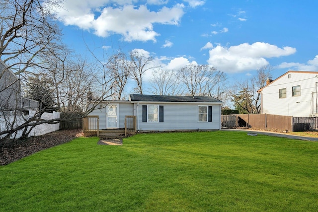 back of house with a yard