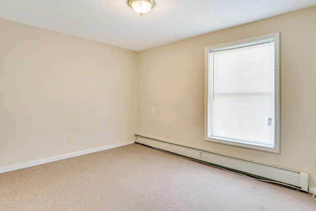 unfurnished room featuring baseboard heating, carpet flooring, and a healthy amount of sunlight