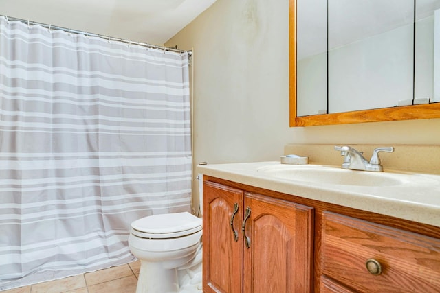 bathroom with tile patterned floors, vanity, and toilet