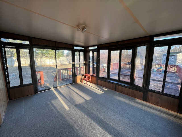 unfurnished sunroom with vaulted ceiling