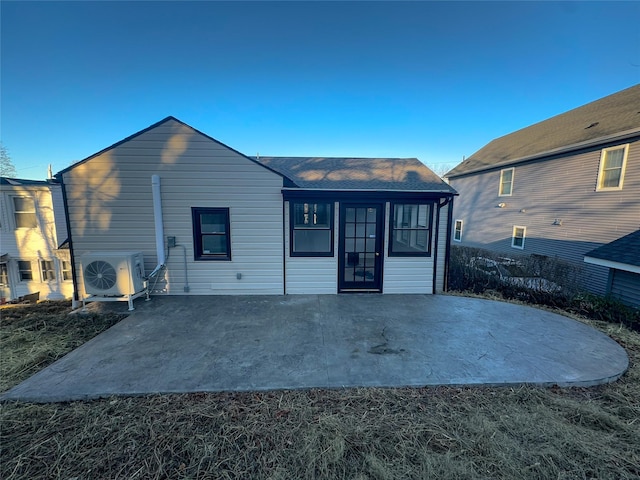 back of house with ac unit and a patio area