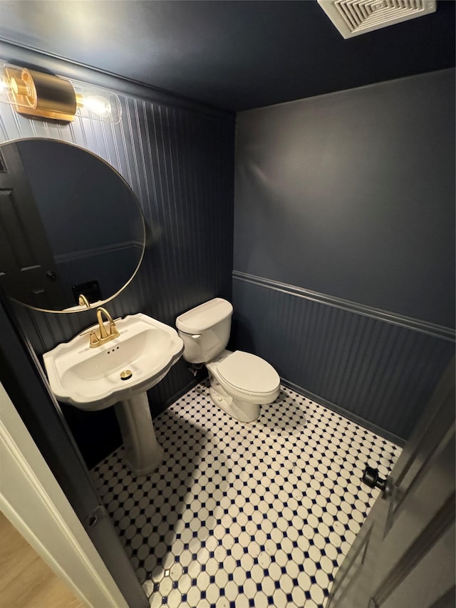 bathroom featuring sink and toilet