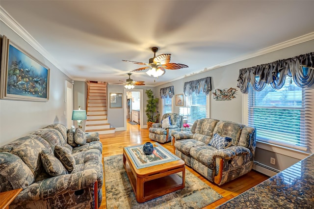 living room with hardwood / wood-style floors, a baseboard heating unit, ornamental molding, and ceiling fan