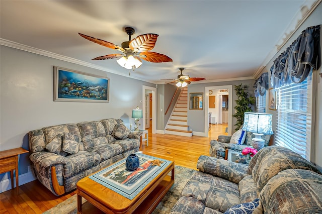 living room featuring ceiling fan, hardwood / wood-style floors, and ornamental molding