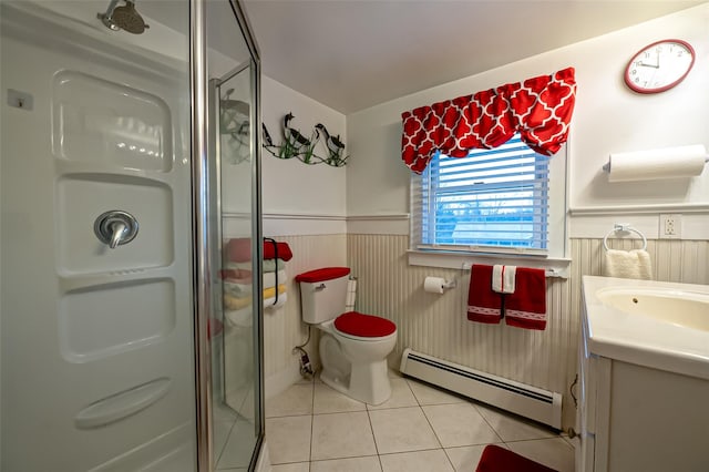 bathroom with vanity, tile patterned floors, toilet, baseboard heating, and walk in shower