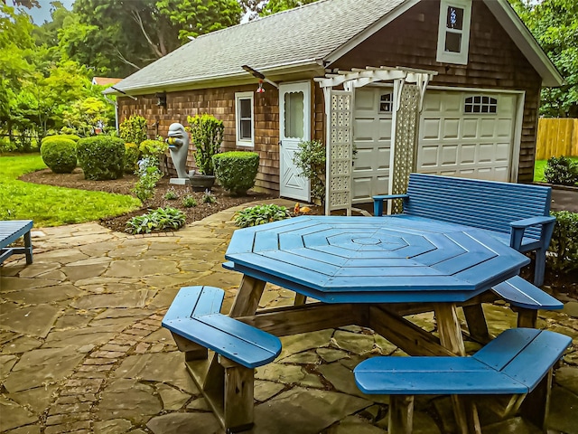 view of patio / terrace with a garage