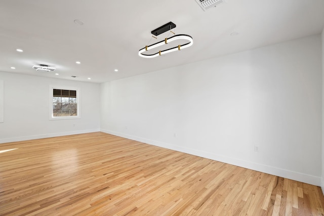 unfurnished room with light hardwood / wood-style flooring