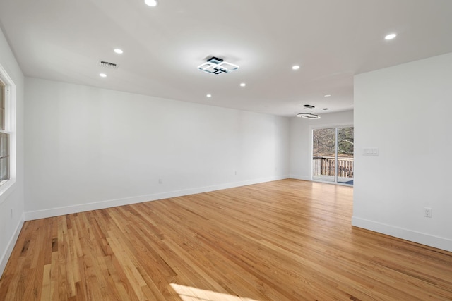 unfurnished room with light hardwood / wood-style floors