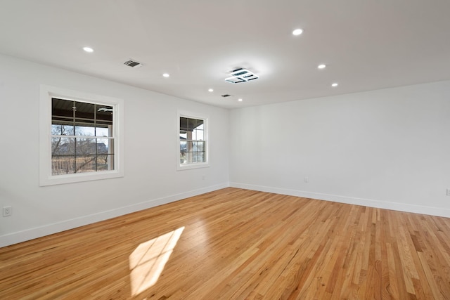 spare room with light hardwood / wood-style flooring