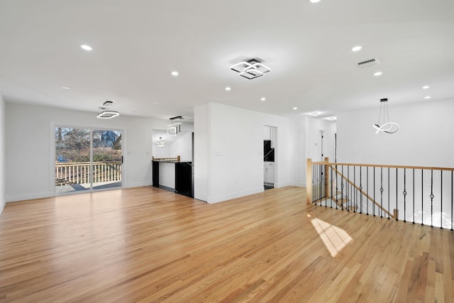 unfurnished living room with light wood-type flooring