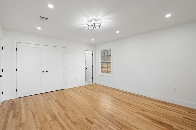 unfurnished bedroom featuring light wood-type flooring