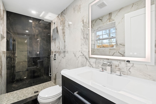 bathroom featuring tiled shower, tile walls, and toilet