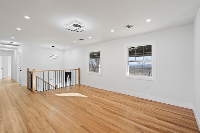 unfurnished room featuring light hardwood / wood-style floors