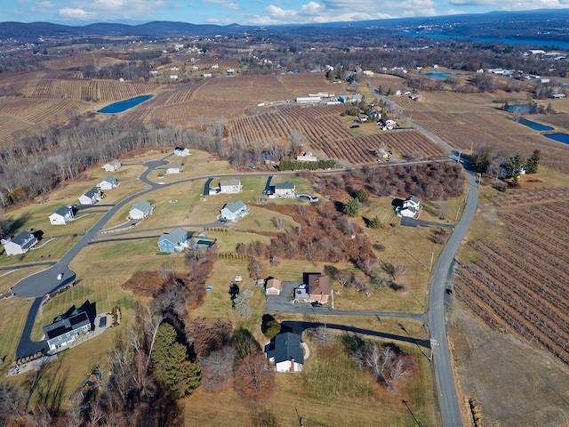 aerial view with a rural view and a water view