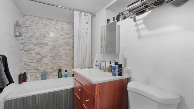 full bathroom with vanity, toilet, and shower / bath combo with shower curtain