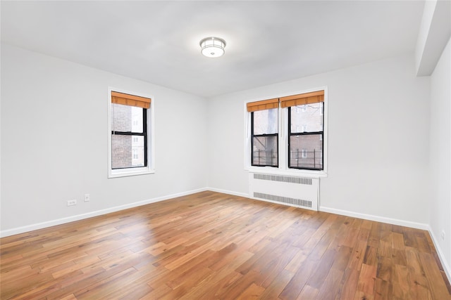 385 Argyle Rd Unit 2K, Brooklyn, NY 11218 - unfurnished room featuring radiator heating unit and light wood-style floors