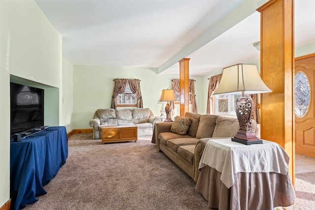 living area featuring carpet and baseboards