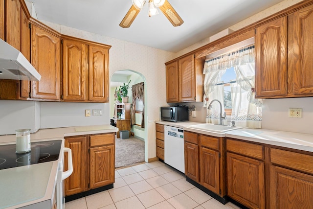 kitchen featuring wallpapered walls, electric stove, dishwasher, black microwave, and a sink