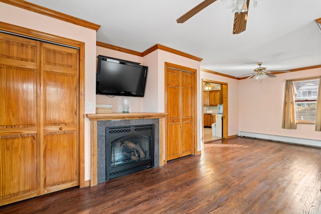 unfurnished living room with a baseboard heating unit, crown molding, a tiled fireplace, and wood finished floors