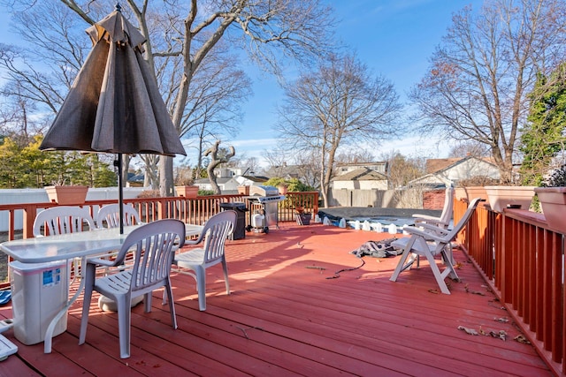 wooden terrace with outdoor dining space