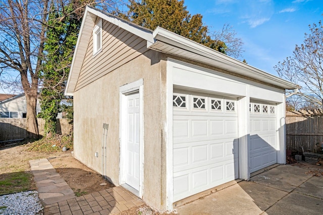 detached garage with fence