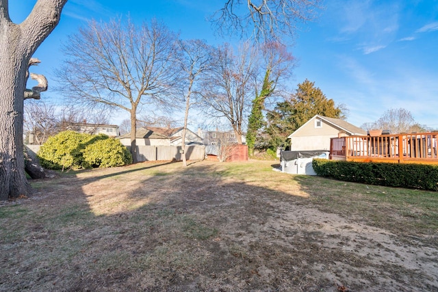 view of yard featuring an outbuilding and a deck