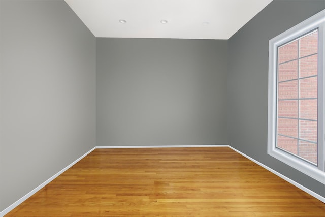 unfurnished room with light hardwood / wood-style floors