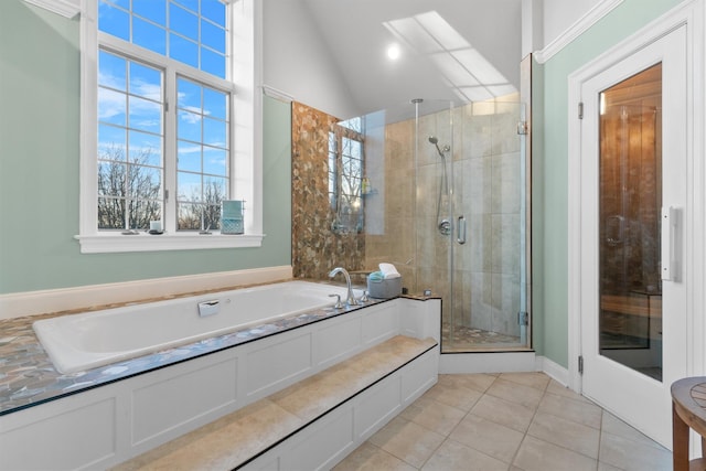 bathroom featuring tile patterned floors, independent shower and bath, and lofted ceiling