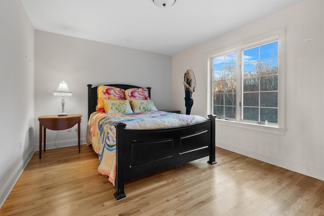 bedroom with wood-type flooring