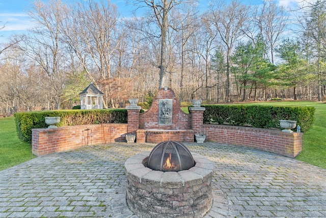 view of patio featuring a fire pit